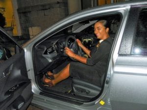 Kedecia Stewart sits in her new car.