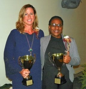Kristen Boyd, 2017-2018 Principal of the Year, left, and Dr. Jacqueline Batchelor-Crosson, 2017-2018 Assistant Principal of the Year, hold their trophies after receiving their awards.